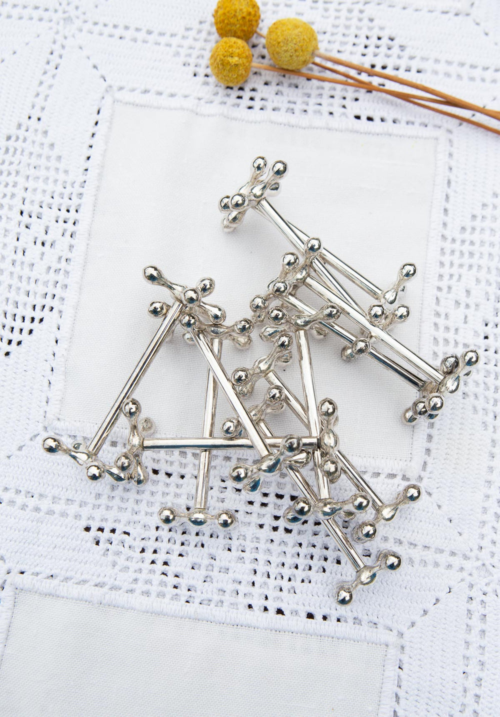 Juego 12 reposacuchillos franceses metal baño plata c. 1950s