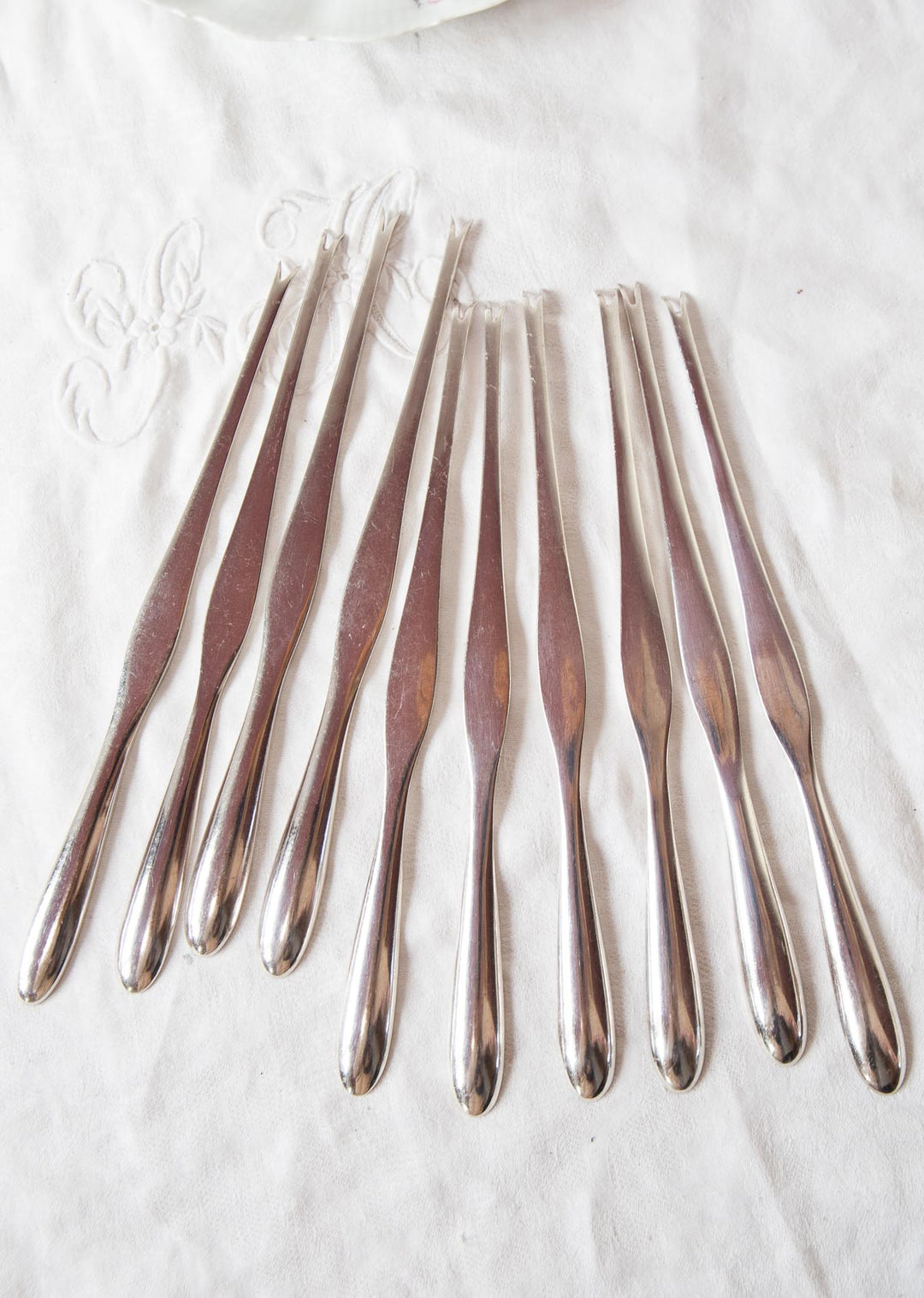 Juego 10 pinchos para MARISCO suecos c. 1950 baño plata