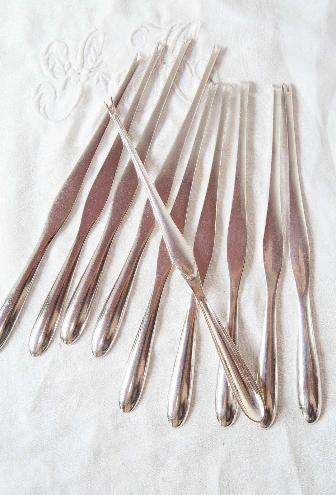 Juego 10 pinchos para MARISCO suecos c. 1950 baño plata