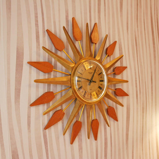 Reloj sol inglés rayos teca y metal años 50/60 (VENDIDO)